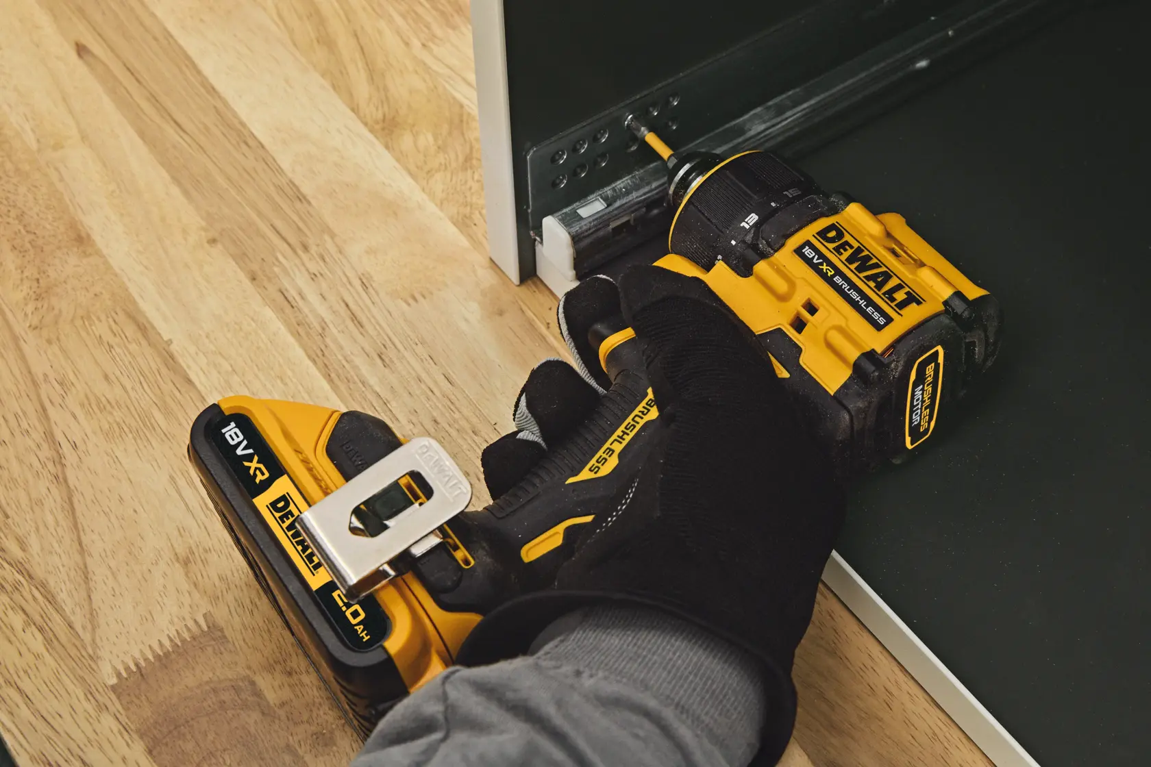 DEWALT DCD803NT-XJ, DCD803NT drill in use, close-up, on wood and metal. Photography category.