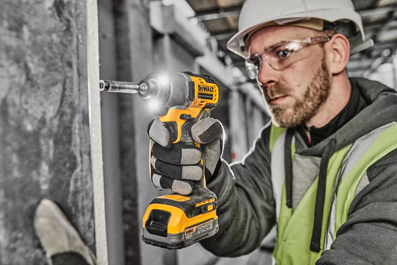 Image of a DEWALT 18V XR Brushless cordless impact driver with Powerstack battery. Key features highlighted are: 360° LED lighting, maximum 192Nm torque, up to 3,200 impacts per minute, and a compact design. Branding and product labels are visible.