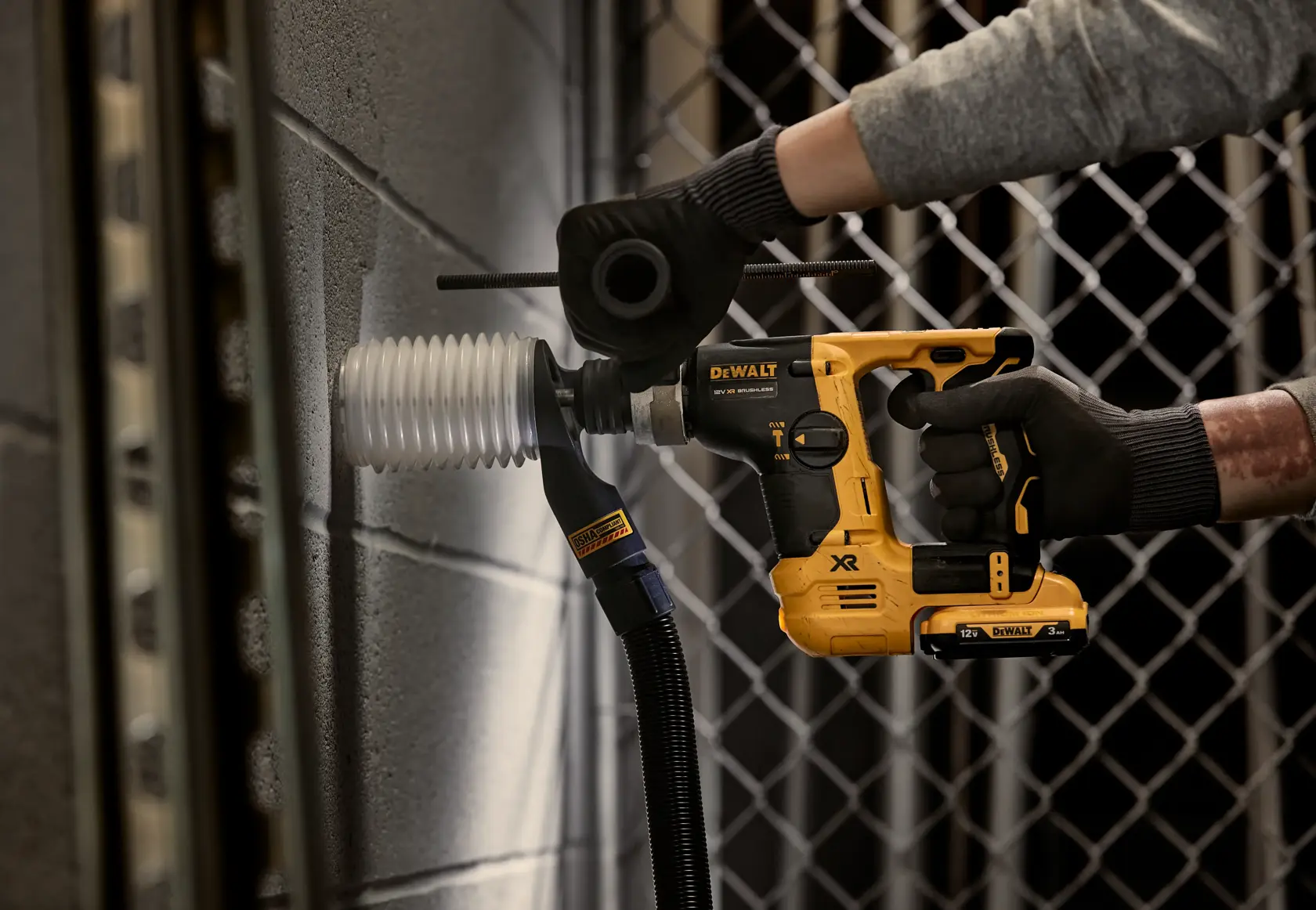 DEWALT tool used on wall. Models DCH072NT, DCH072N, DCH072N-XJ. Photography product category.